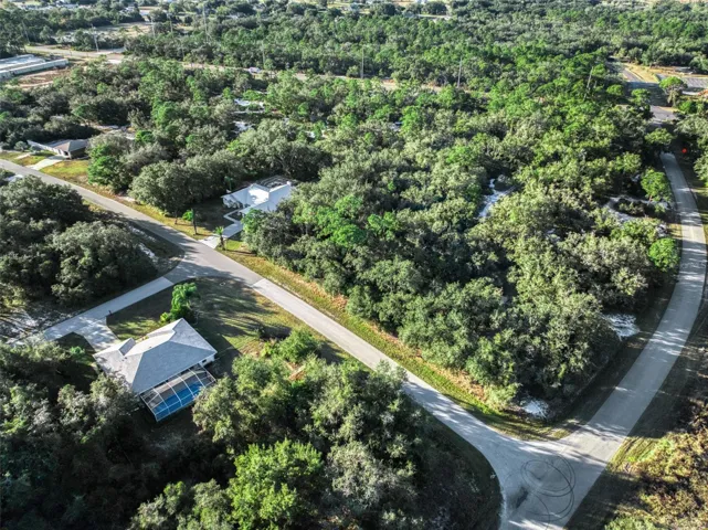 Aerial View of Parcel with cross street leading to entrance.