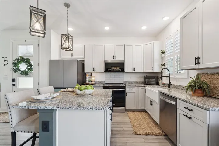 Kitchen with Upgraded Appliances, Kitchen Cabinets, Lights Fixtures, and Farm Sink