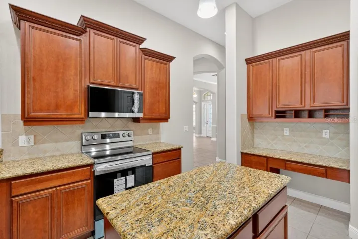 Solid Wood cabinets, New Stainless Appliances, Granite Counter Tops, Large Pantry and an Island