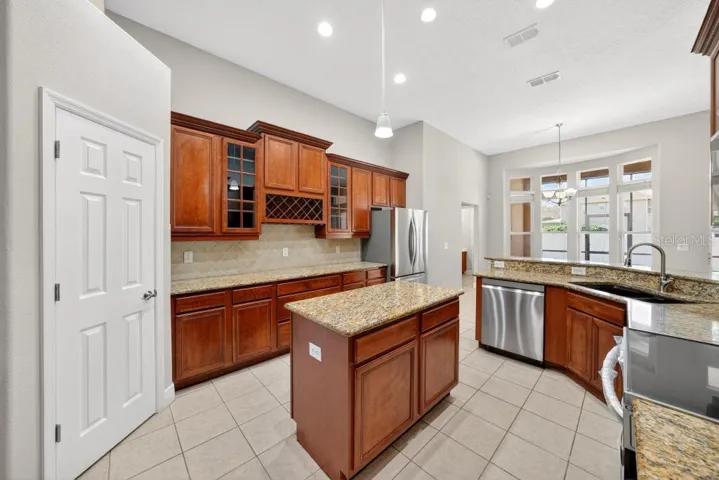 Solid Wood cabinets, New Stainless Appliances, Granite Counter Tops, Large Pantry and an Island