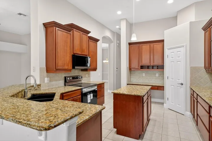 Solid Wood cabinets, New Stainless Appliances, Granite Counter Tops, Large Pantry and an Island