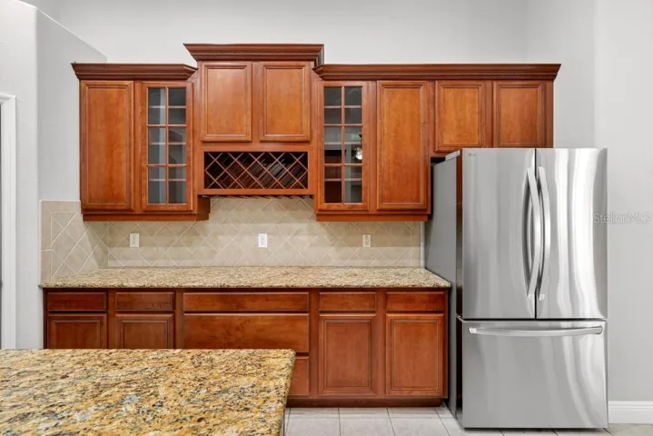 Solid Wood cabinets, New Stainless Appliances, Granite Counter Tops, Large Pantry and an Island