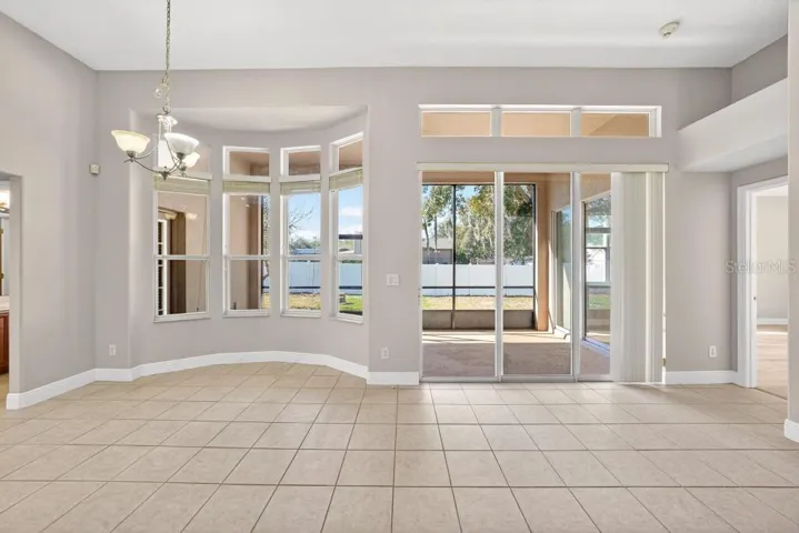 Looking out to the Screened Porch and Living Area from Kitchen