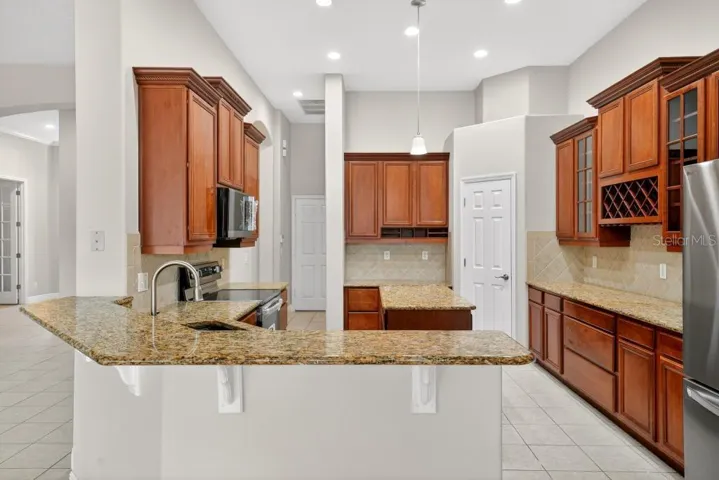Solid Wood cabinets, New Stainless Appliances, Granite Counter Tops, Large Pantry and an Island