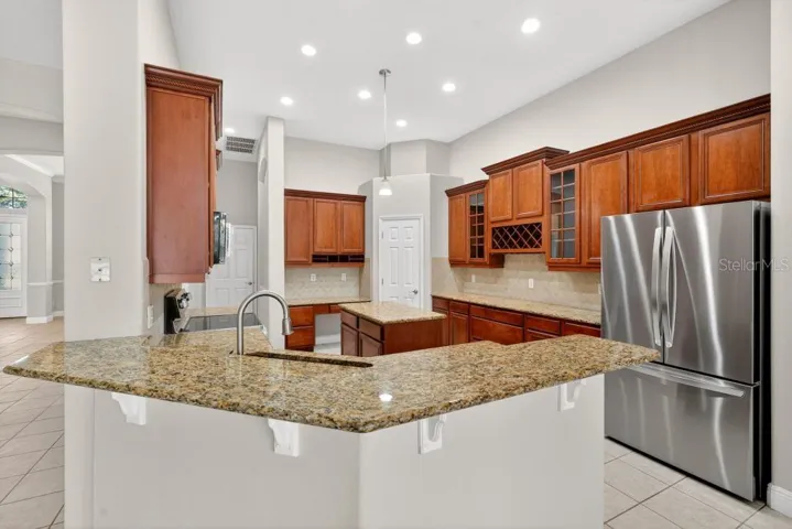 Solid Wood cabinets, New Stainless Appliances, Granite Counter Tops, Large Pantry and an Island