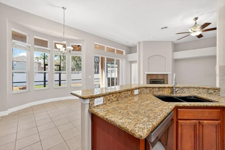 Looking out to the Screened Porch and Living Area from Kitchen