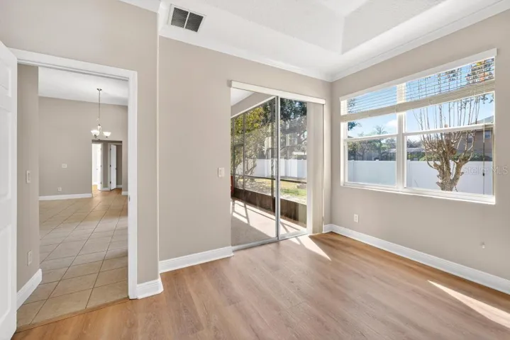 Main Floor Primary Bedroom access to Screened Porch