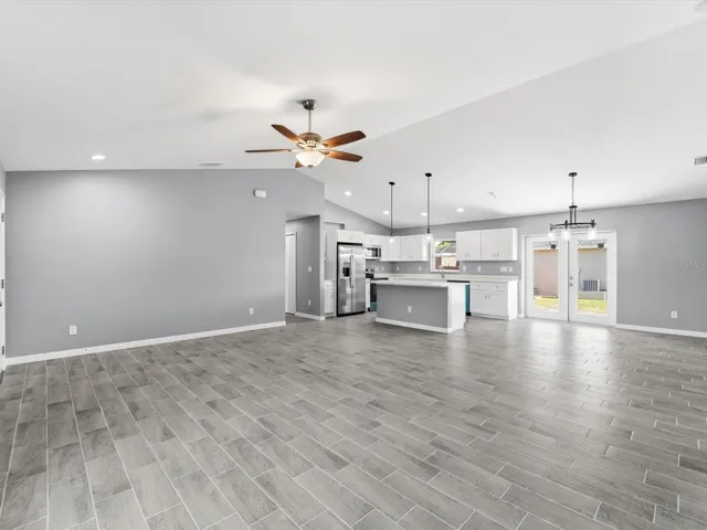 Living room facing kitchen/dining area