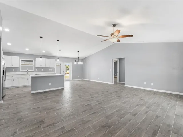 Living room facing kitchen/dining area