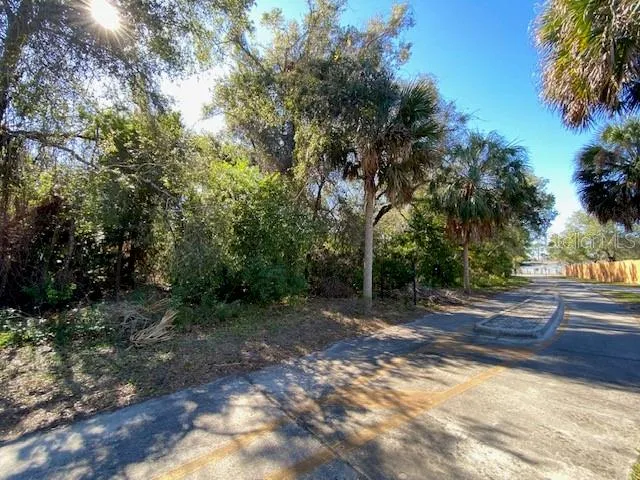 FRONT / NORTH PROPERTY LINE ALONG BIKE PATH