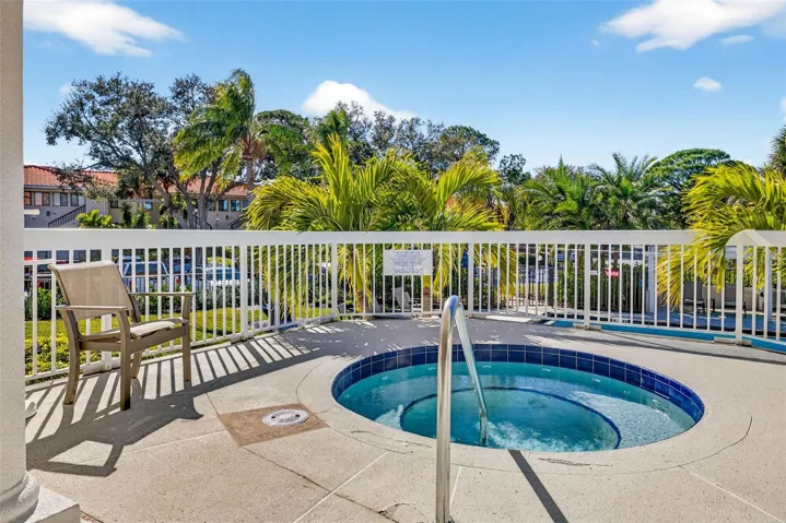 Spa overlooking the pool and grounds. Your personal oasis for unwinding anytime.