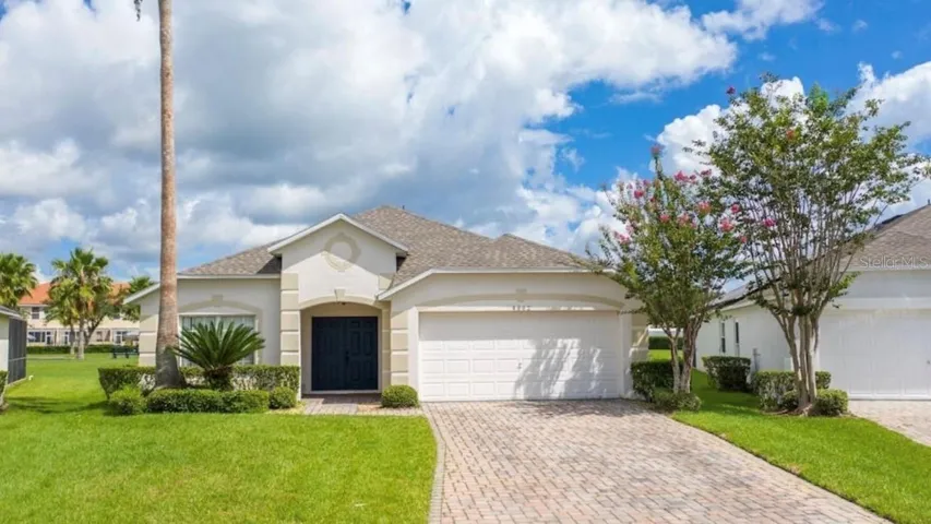 Front of home with paved driveway