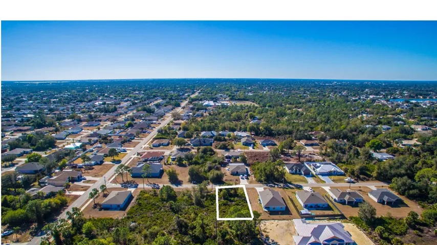 Looking south with a rear view of the lot.
