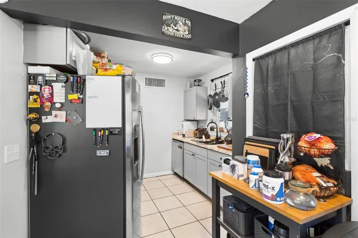 View of kitchen, with stainless steel appliances.