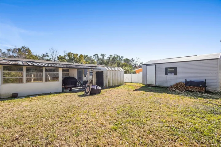 View of property, and sheds.