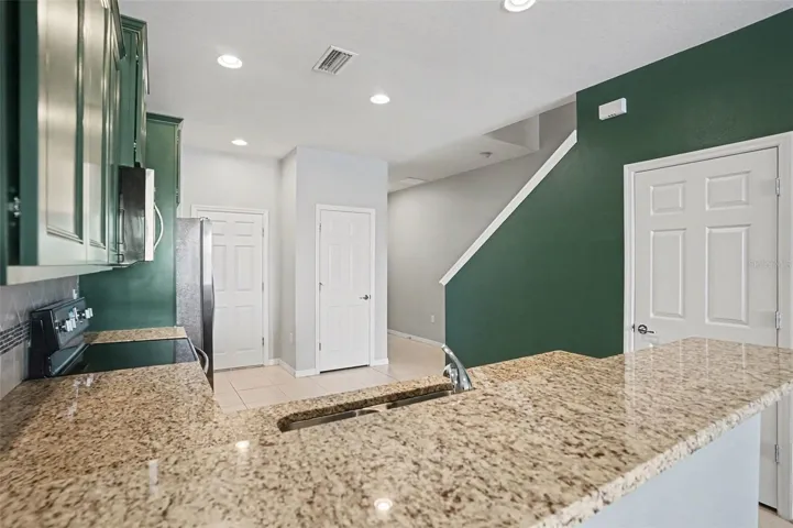 Kitchen with view of foyer