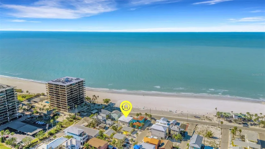 ARIEL VIEW OF BEACH AND CONDO