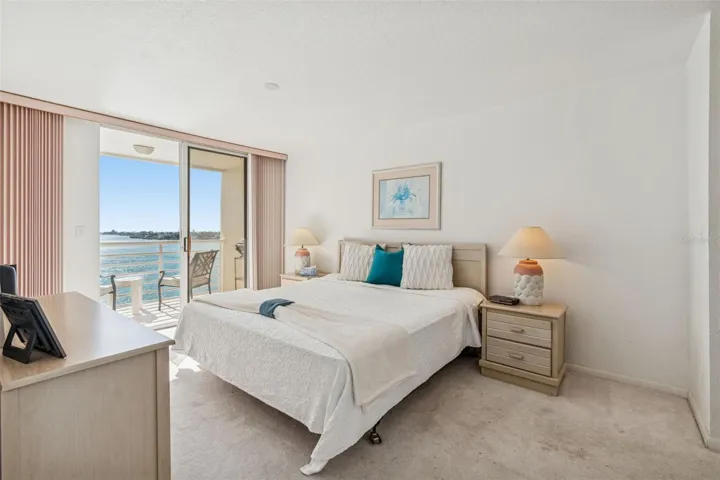 Primary bedroom with attached balcony