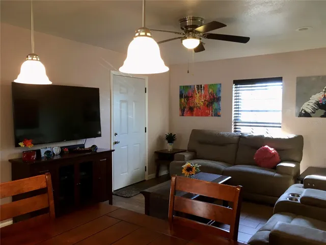 Living room & front door entrance to home