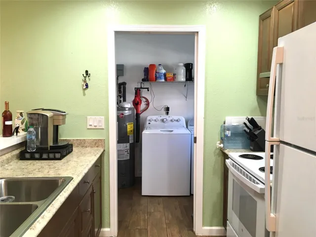 Laundry room conveniently located right off kitchen