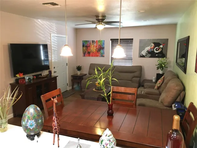 Living room & front door entrance as seen from kitchen sink counter