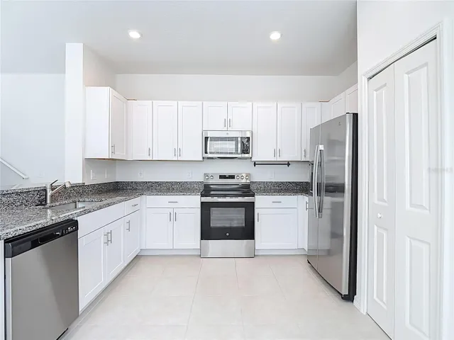 Bright White Kitchen with Stainless Appliances