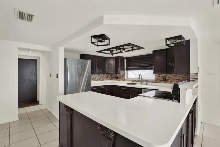 Pantry, garage entry, & Guest bath are to the far right