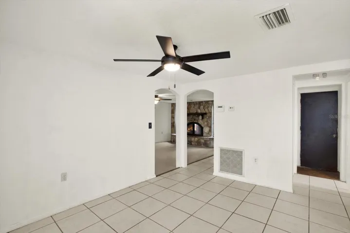 Arched doorways - view from dining area to the living/family room. Garage door is to your far right