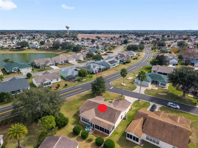 AERIAL looking SOUTHEAST- showcasing the oversized corner lot and close proximity to Spanish Springs Town Square (deep L center, beyond water tower)