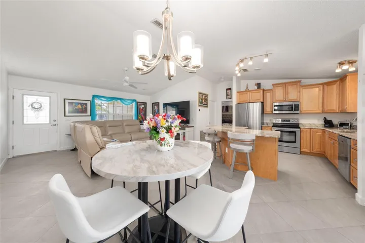 DINING ROOM (front), LIVING ROOM (back L), & KITCHEN (back R)