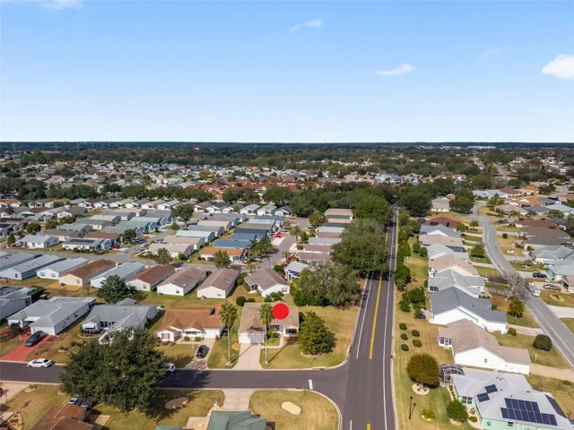 AERIAL looking NORTH - showing close proximity to the Santo Domingo postal station one block North (right center beneath trees), with El Camino Real just beyond offering quick access to Spanish Springs Town Square  (east), US 441 Commercial Corridor (east), and Buena Vista Blvd (west).