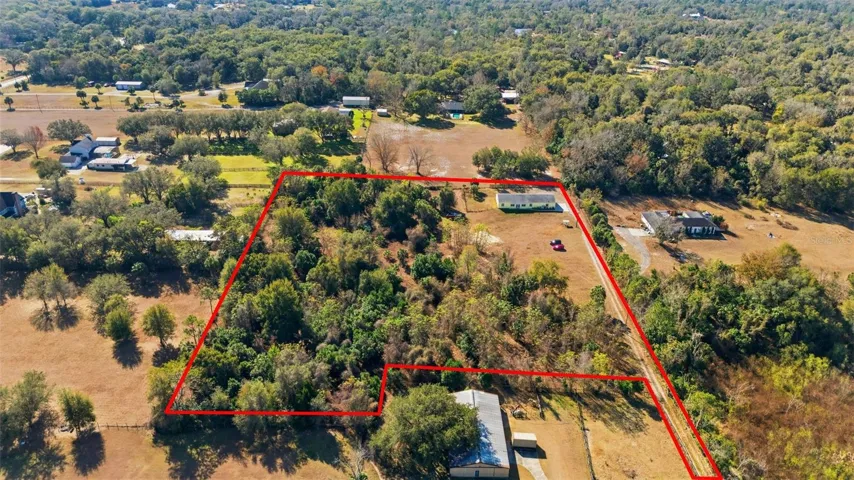 Aerial View of Property. Red lines for illustration purposes only. Buyer to verify property lines with survey.