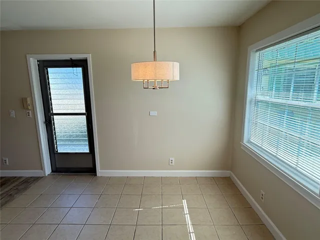 Dining area includes new high impact window