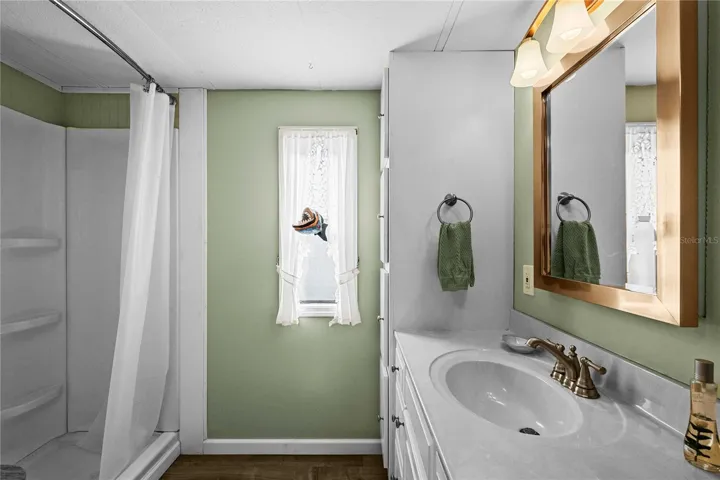 Second bathroom with step-in shower.
