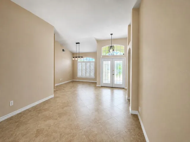 New light fixtures and soaring ceilings as you enter this spacious home