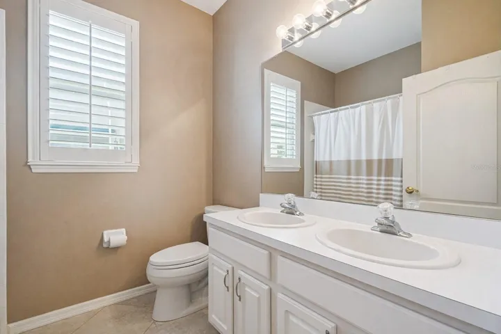 Guest bath also has double vanities