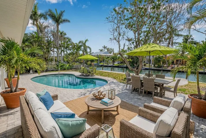 Pool area at the end of the entryway virtually staged