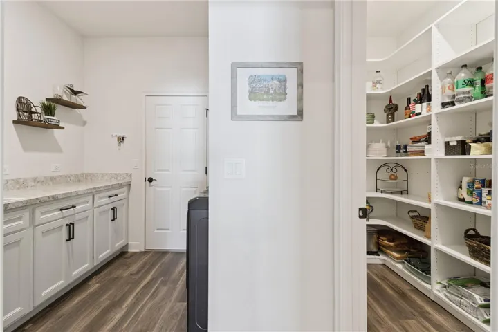 Laundry/pantry with custom built in shelves
