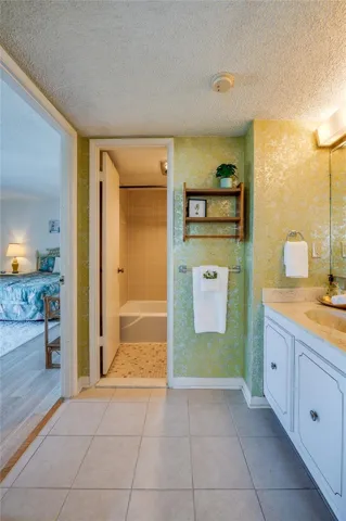 Located just off the bedroom, this vanity space includes a wide countertop and under-sink storage.