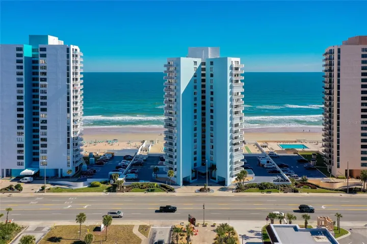 Aerial image shows the building’s premium beachfront location with direct sightlines to the Intracoastal Waterway across the street.