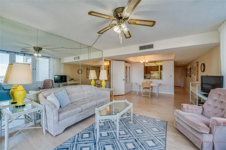 Open-concept layout flows from the living area to the dining and kitchen spaces, creating an ideal setup for everyday living or entertaining.