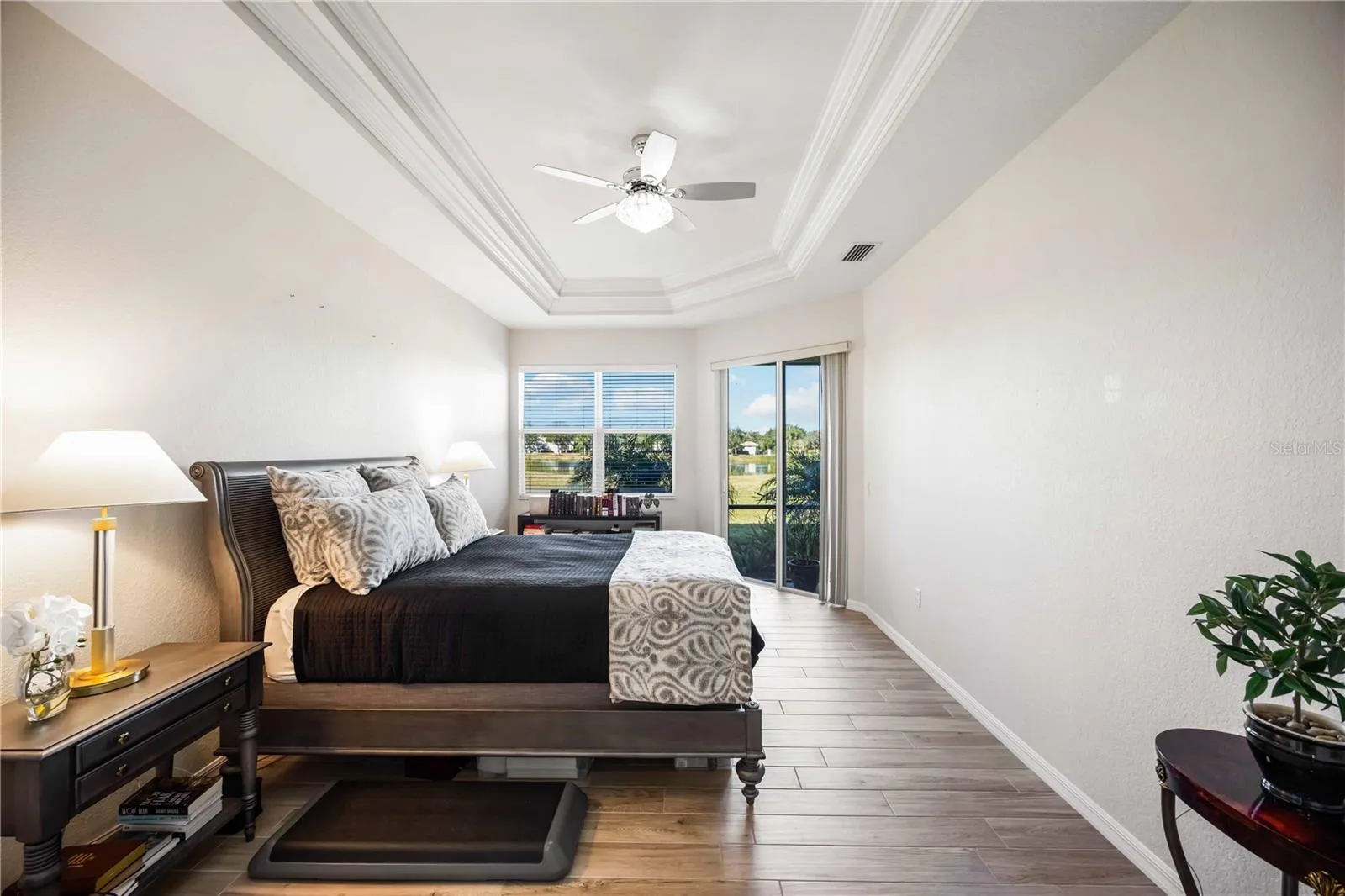 Tray ceilings in Master Bedroom with sliders leading into the lanai