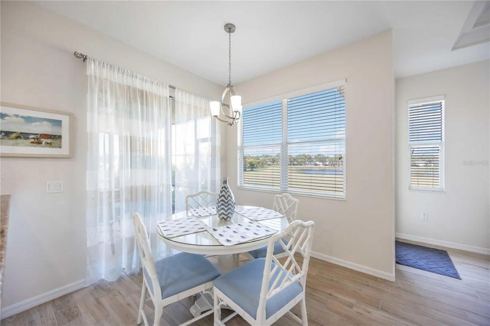 Eat-in Kitchen that leads to the screened Lanai and back yard