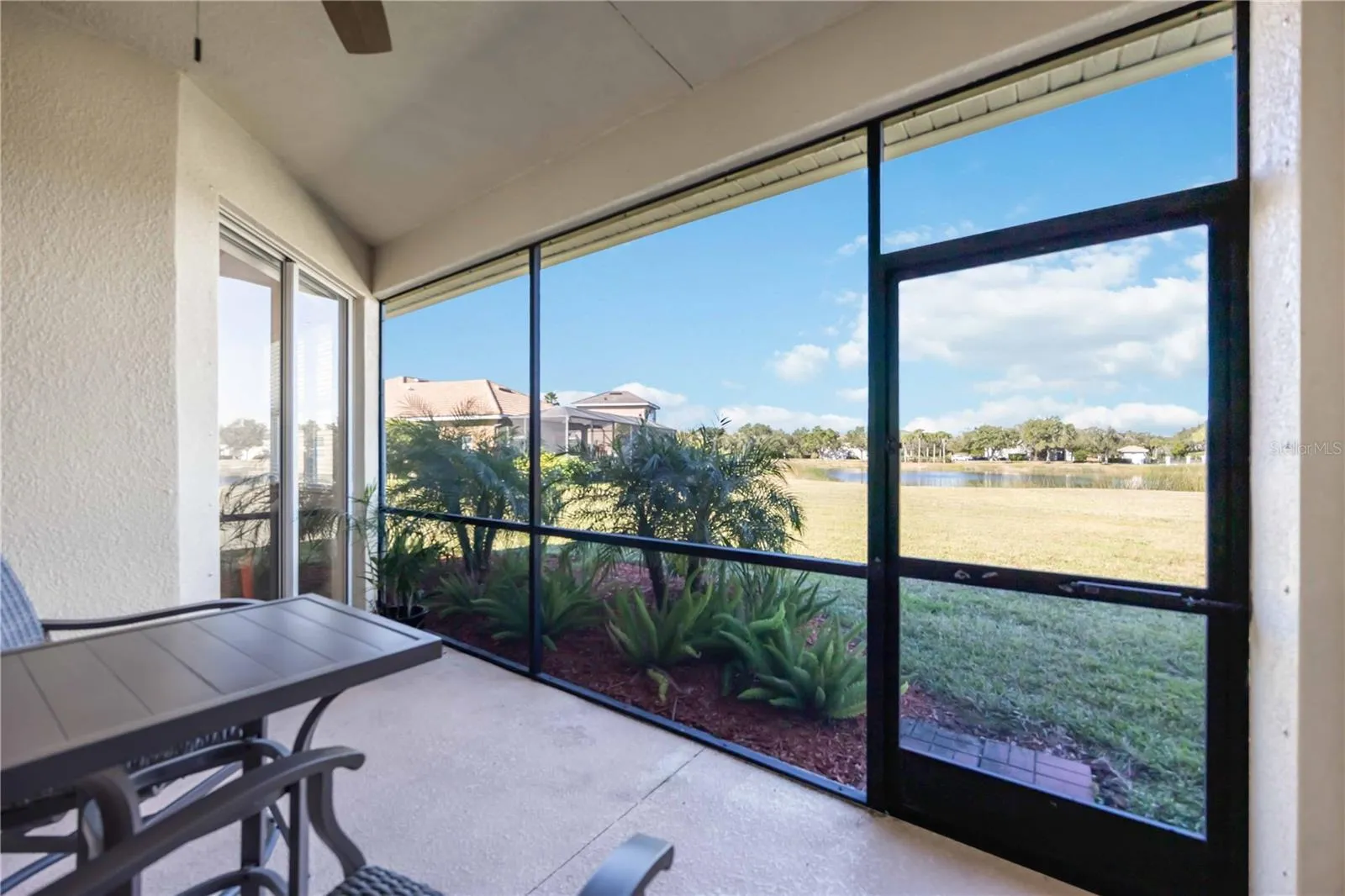 Lanai overlooking spacious back yard and large waterfront views