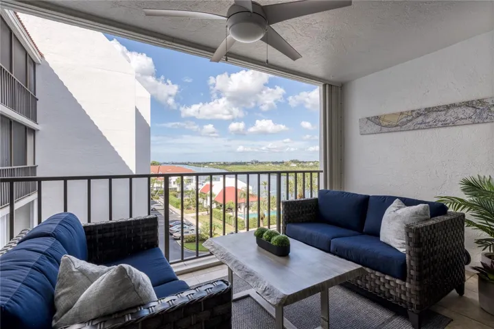 iv. Room Balcony, seating and two-top table
