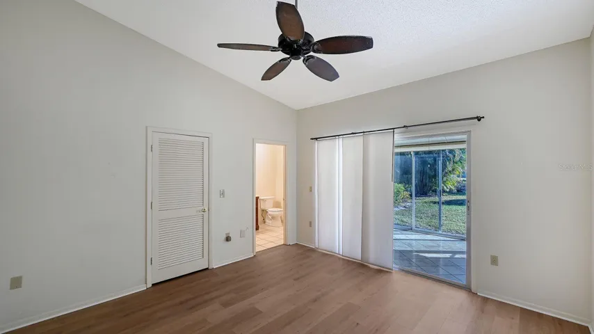 Primary Bedroom with a Vaulted Ceiling