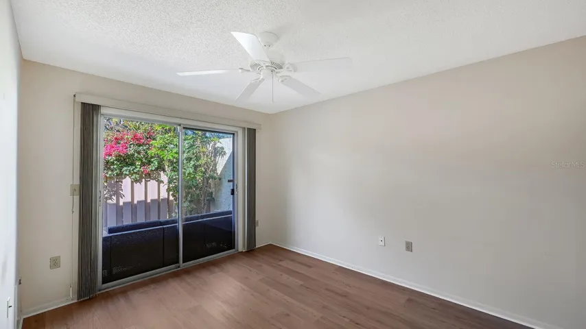 2nd Bedroom with a Sliding Glass Door that opens to the Front Porch