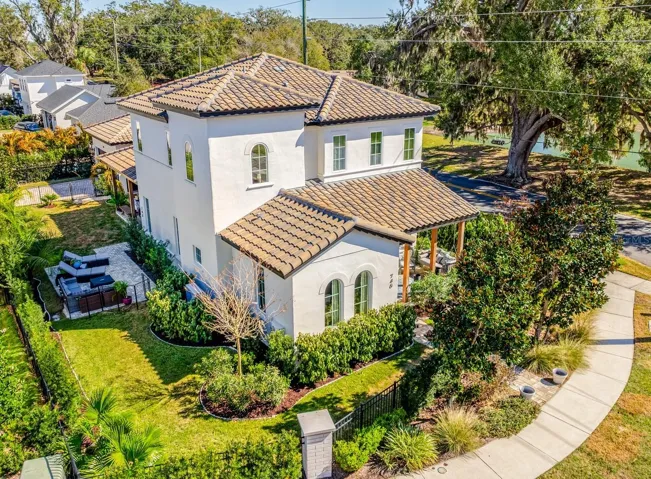 Built by J&J Custom Homes, this one-of-a-kind residence sits on a .18 ACRE ~ CORNER LOT with tranquil pond views, bordering the WEST ORANGE TRAIL and located within Winter Garden’s coveted GOLF CART DISTRICT!