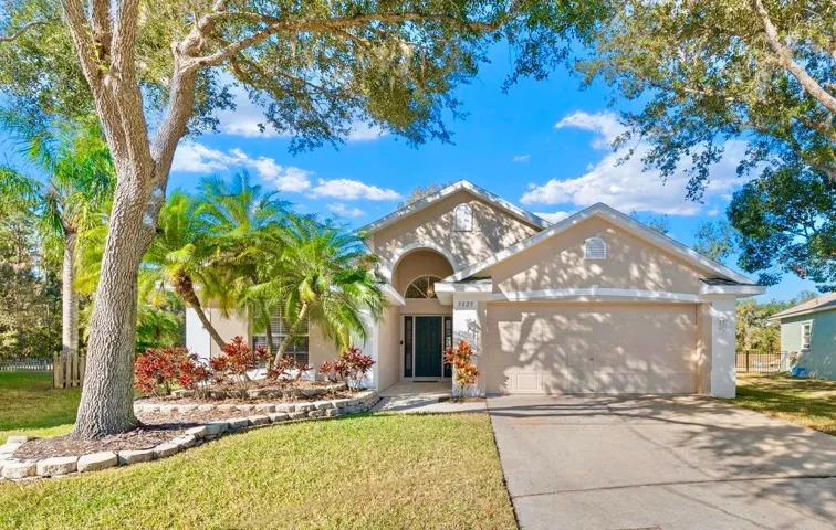 Beautiful oak trees in the front shade the home, but don't hover over the home.