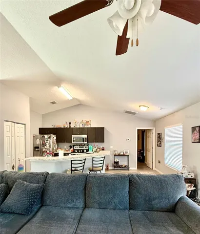 Living area looking into kitchen area